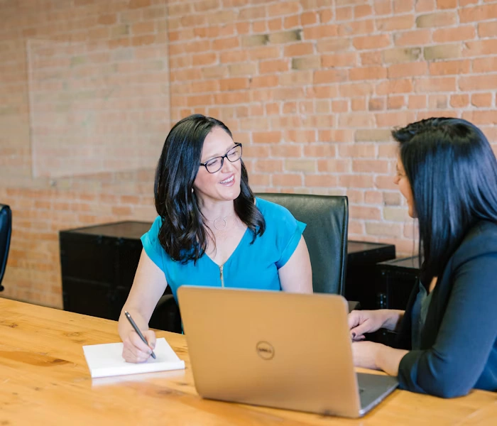 Professionals discussing online notary services in a business meeting